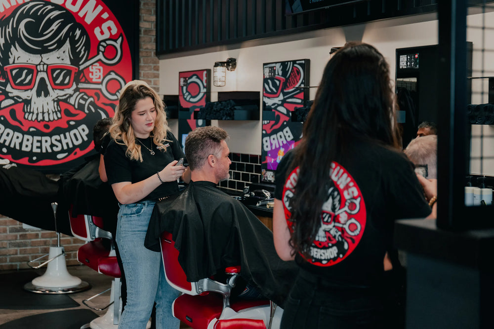 Photo of man getting a haircut at a Tommy Gun's Original Barbershop